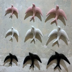 Trio of White Swallows