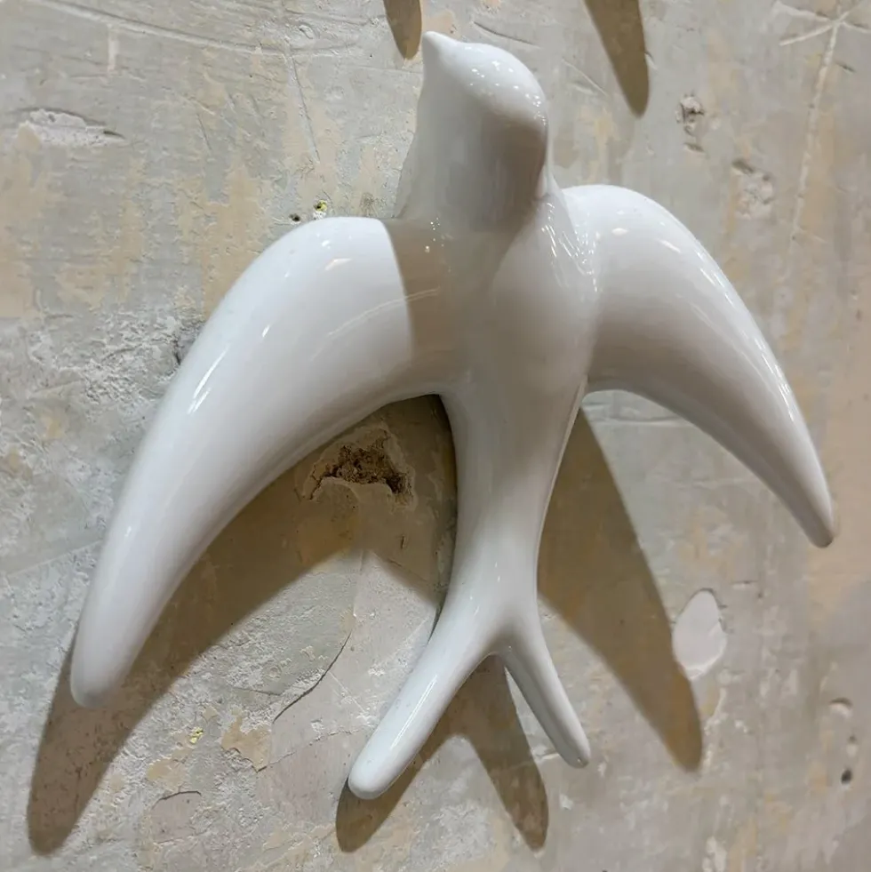 Trio of White Swallows
