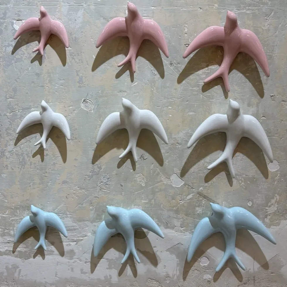 Trio of White Swallows